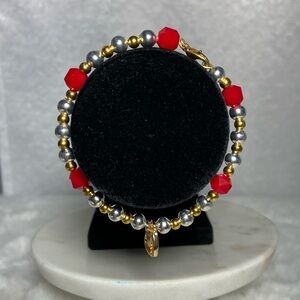 set of three bracelets with charm